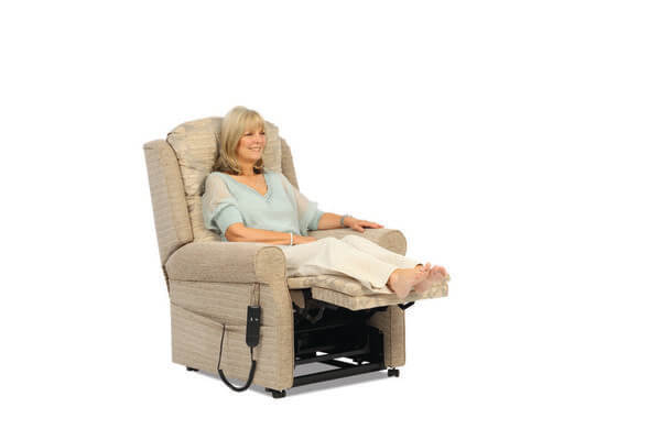 The Norfolk chair with someone with legs up