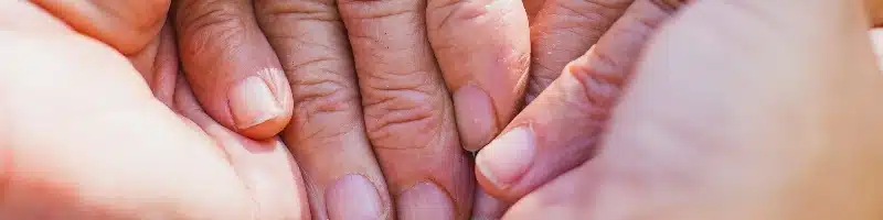 parkinsons-patient-holding-hands-resized